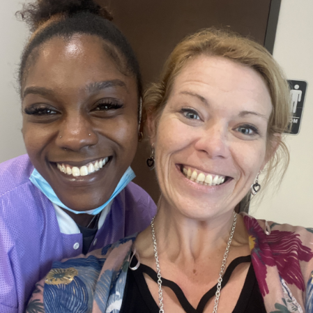 Selfie of a dental team member smiling with a patient