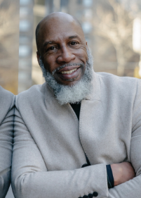 Smiling man with a gray beard