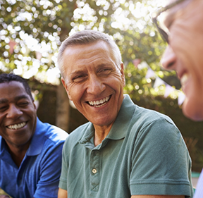 Group of men laughing together outdoors