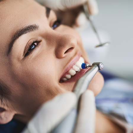 Woman receiving a professional dental cleaning